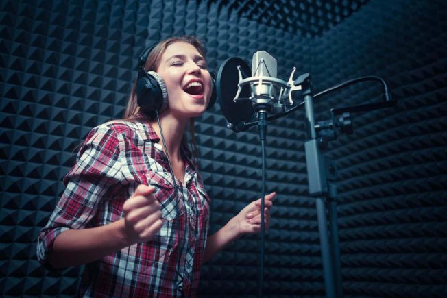 Girl in Vocal Booth Practicing Best Vocal Warm-Ups